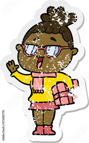 distressed sticker of a cartoon happy woman wearing spectacles