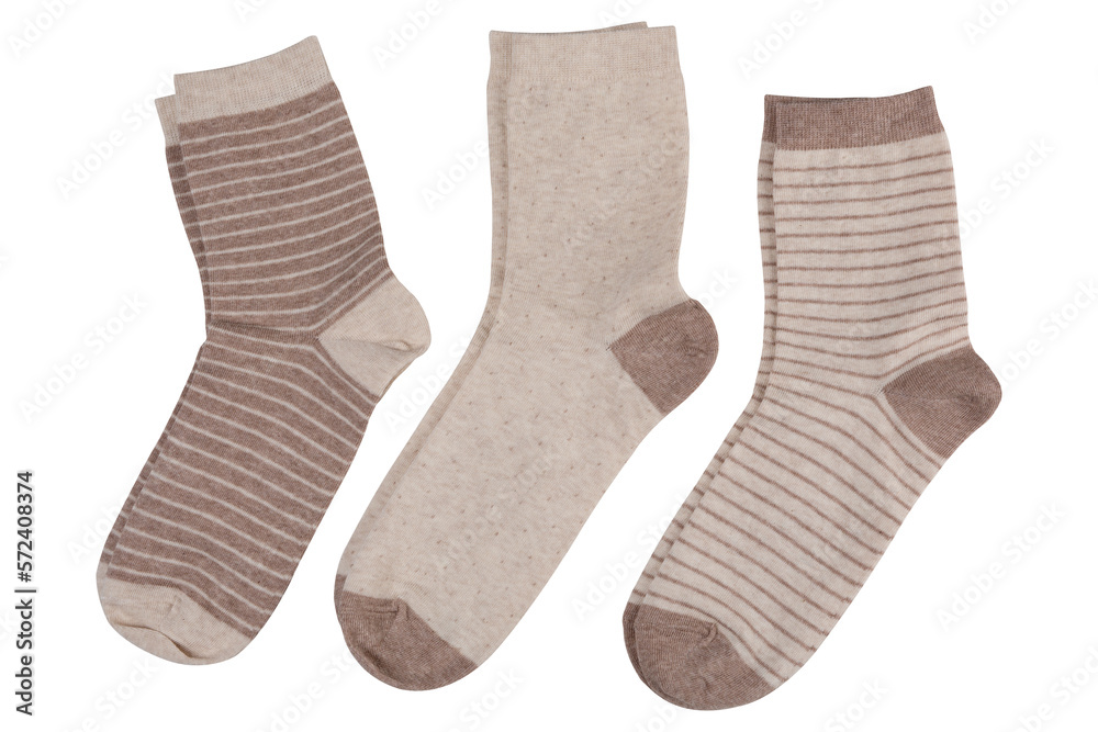 Three pairs of socks, with and without stripes, in a row, on a white background, isolate Three pairs of socks, with and without stripes, in a row, on a white background, isolate