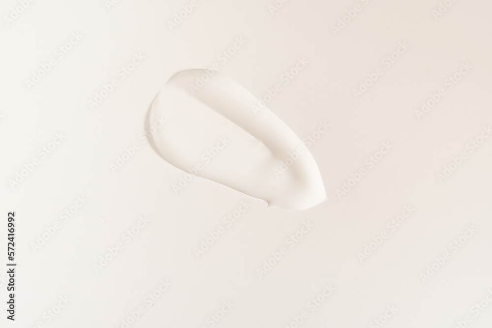 A smear of cosmetic cream. A white creamy drop of skin care cream. Fresh, smooth brushstroke isolated on a white background with space to copy. High quality photo A smear of cosmetic cream. A white creamy drop of skin care cream. Fresh, smooth brushstroke isolated on a white background with space to copy. High quality photo