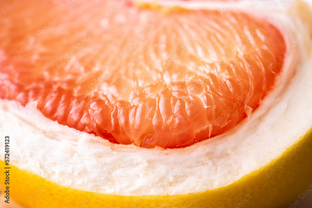 Pomelo on a white background.Advertising pomelo.Grapefruit.Pomelo pink. Fruit isolated.Cut pomelo on white background.Pomelo macro shot.Grapefruit macro shot.Juice drops on the fruit. fruit macro shot Pomelo on a white background.Advertising pomelo.Grapefruit.Pomelo pink. Fruit isolated.Cut pomelo on white background.Pomelo macro shot.Grapefruit macro shot.Juice drops on the fruit. fruit macro shot