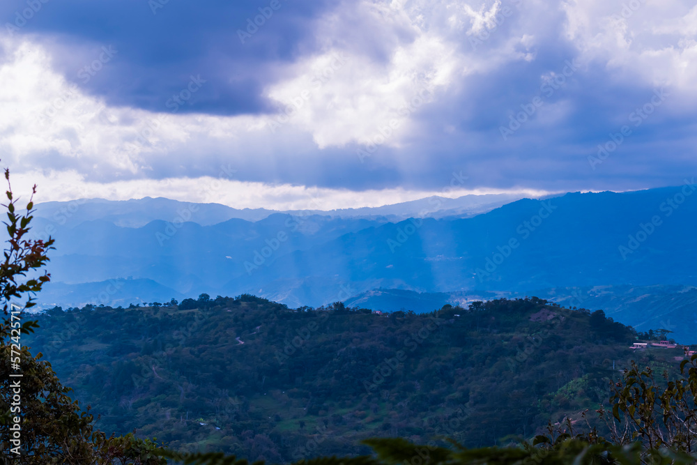 Sunbeams in a hilly landscape. Santander, Colombia.