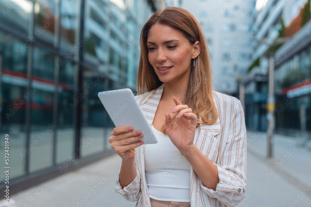 Portrait of a successful business woman using digital tablet Portrait of a successful business woman using digital tablet