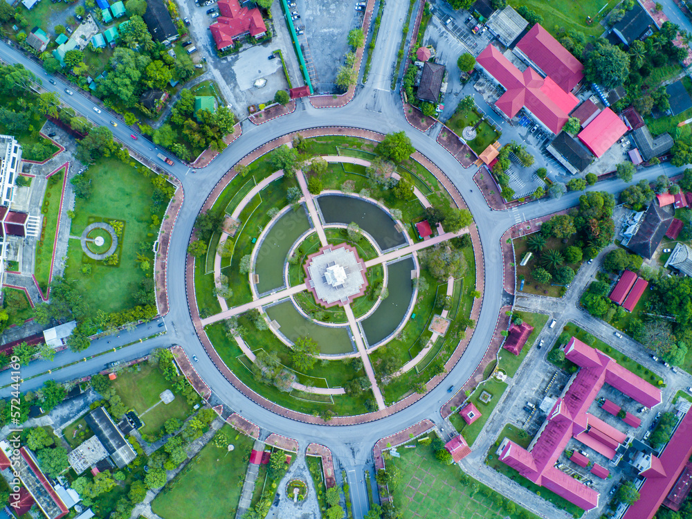 Aerial view of urban traffic lane in Road roundabout with car lots Wongwian Yai in Yala,Thailand.street large beautiful downtown plan, Top view of cityscape and transport highway
