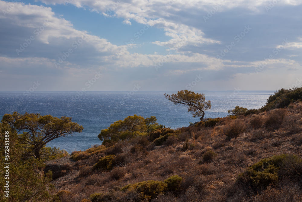 Beautiful seascape. Coast of the island of Crete - Greece area of Lerapetra Eden Rock. There are dramatic clouds in the sky. Beautiful seascape. Coast of the island of Crete - Greece area of Lerapetra Eden Rock. There are dramatic clouds in the sky.