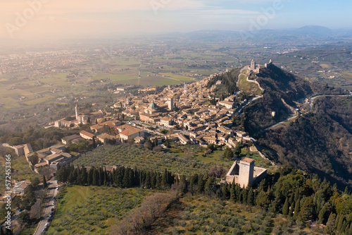 aerial view of assisi umbria with the city in the background at sunrise