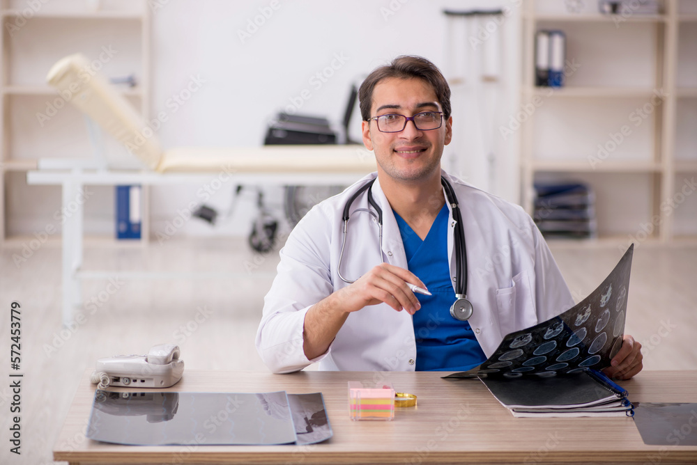 Young male doctor radiologist working in the clinic Young male doctor radiologist working in the clinic