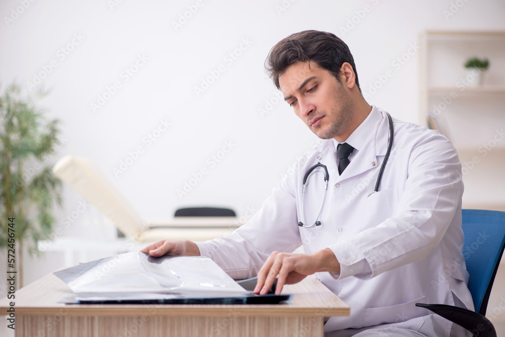 Young male doctor radiologist working in the clinic Young male doctor radiologist working in the clinic