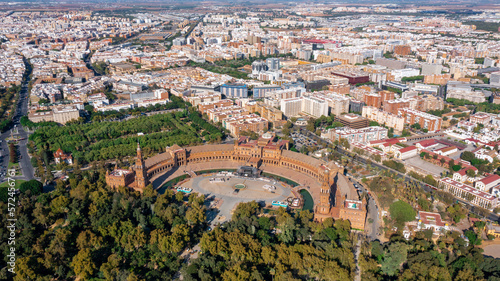 Aerial view of Spanish city of Seville in Andalusia region on river Guadaquivir overlooking Plaza de Espana and Parque Maria Luisa sunny day