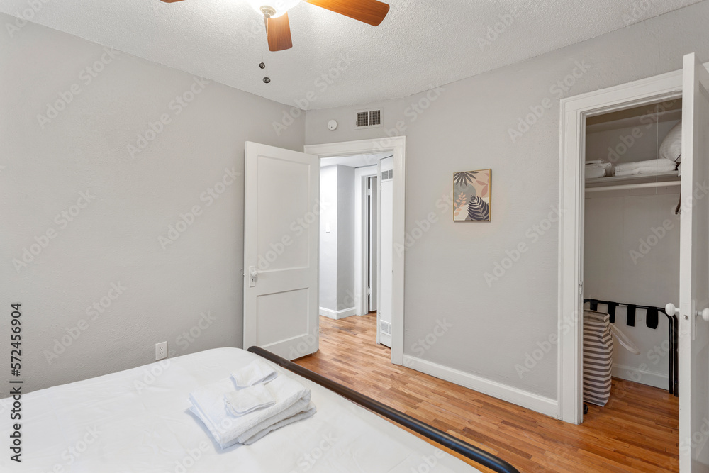 White apartment with wide open spaces, hardwood flooring and modern furniture. Used as a short term rental. White apartment with wide open spaces, hardwood flooring and modern furniture. Used as a short term rental.