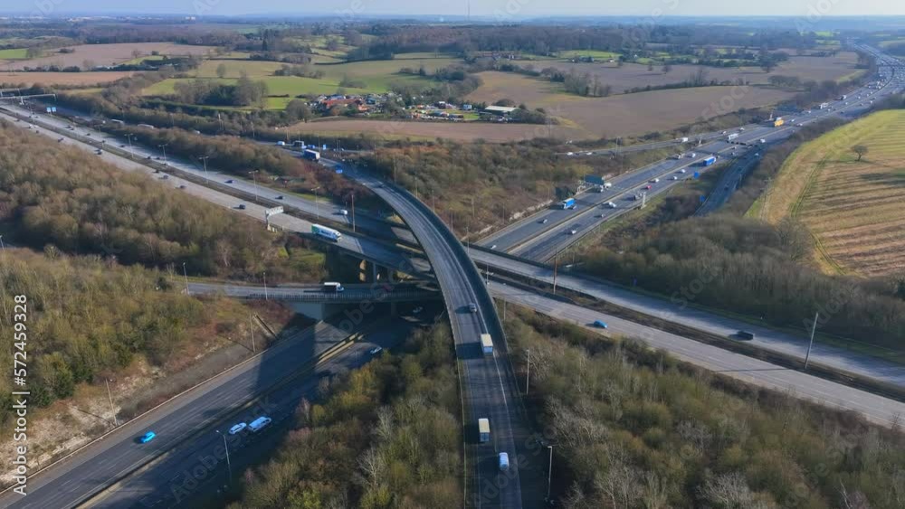 Rush Hour Vehicles Driving on a Highway Interchange Junction Aerial View Rush Hour Vehicles Driving on a Highway Interchange Junction Aerial View