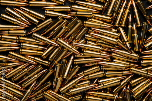 Background from cartridges for a carbine. Ammunition for modern weapons.