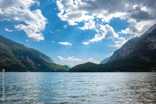 Idyllic view of beautiful Lake of Molveno, province of Trento, Trentino Alto-Adige, Italy, in a cloudy and sunny summer day, surrounded by Dolomiti del Brenta mountains © oltrelautostrada