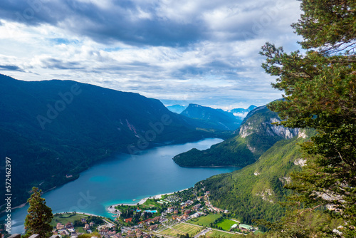 Idyllic view of beautiful Lake of Molveno, province of Trento, Trentino Alto-Adige, Italy, in a cloudy and sunny summer day, surrounded by Dolomiti del Brenta mountains
