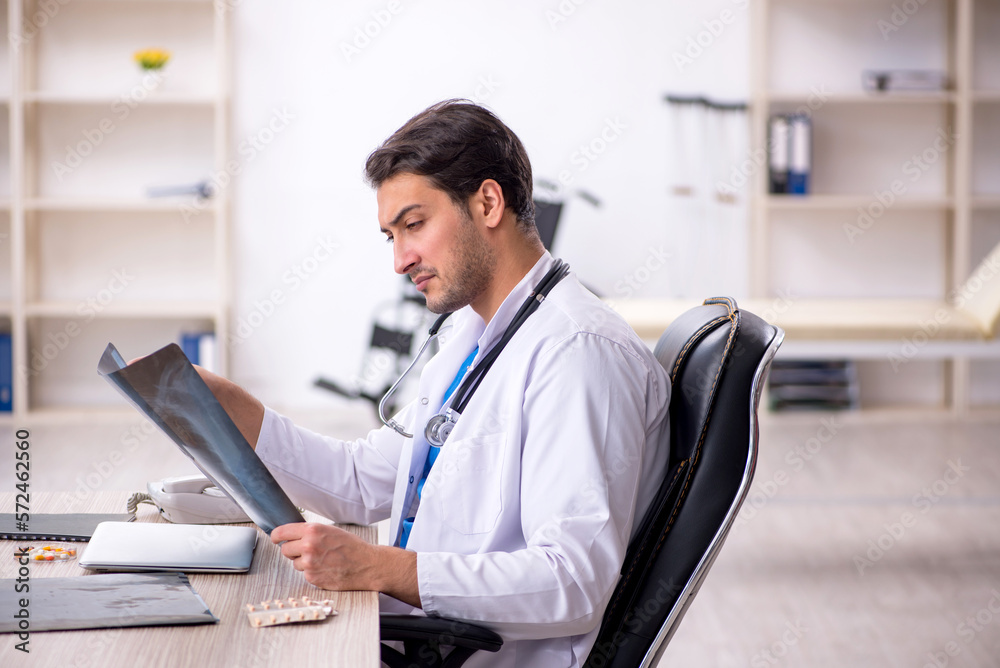 Young male doctor radiologist working in the clinic Young male doctor radiologist working in the clinic