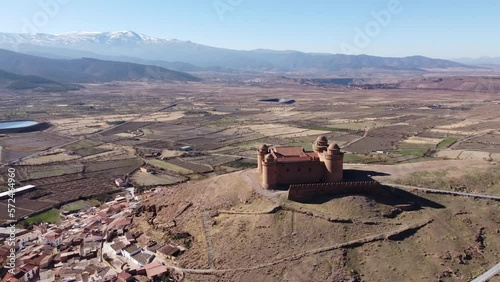 Aerial view of La Calahorra castle, showcasing its Renaissance courtyard, situated near Granada in Andalusia, Spain. This location is featured in the TV series The House of the Dragon, Pentos Castle