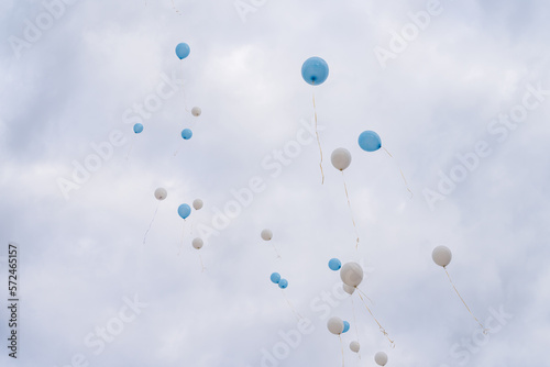 Balloons released into the sky on a festive day.