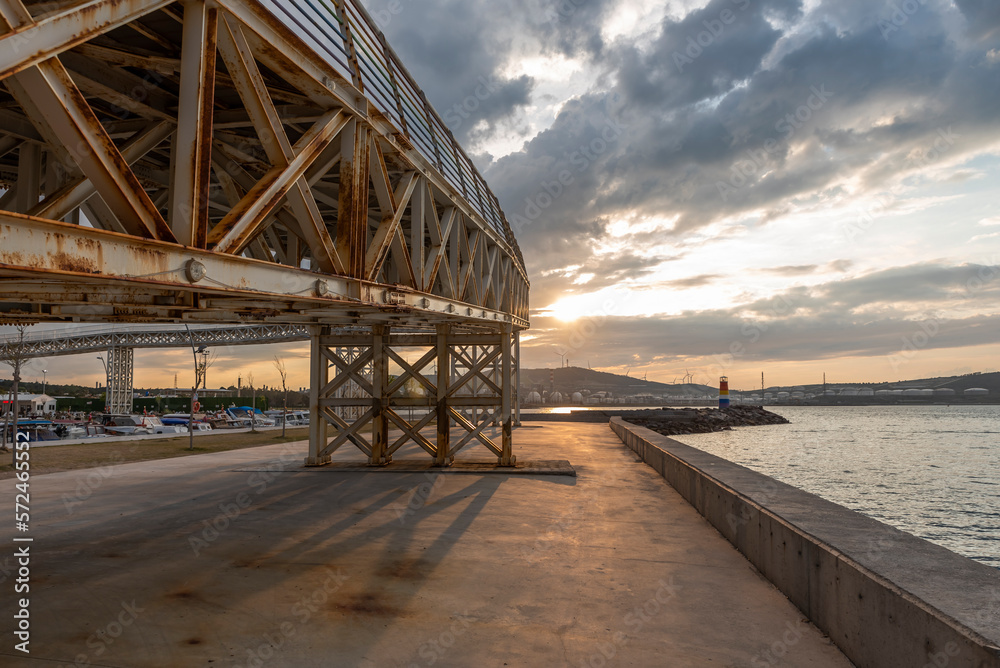 Naklejka premium View of Avci ramadan park from aliaga izmir, colorful lighthouse and iron bridge shoted in different times and light conditions with landscape concept idea
