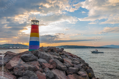 View of Avci ramadan park from aliaga izmir, colorful lighthouse and iron bridge shoted in different times and light conditions with landscape concept idea photo