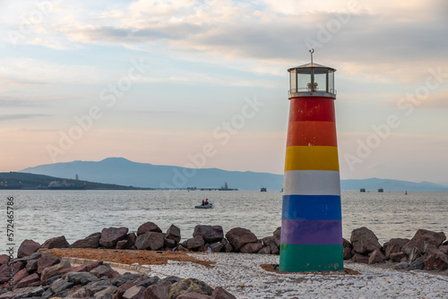 View of Avci ramadan park from aliaga izmir, colorful lighthouse and iron bridge shoted in different times and light conditions with landscape concept idea photo