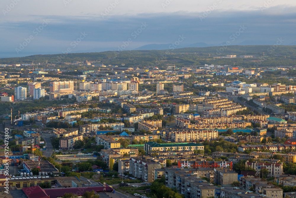 Morning cityscape. Top view of the buildings and streets of the city. Residential urban areas at sunrise. Beautiful aerial city landscape. Petropavlovsk-Kamchatsky, Kamchatka Krai, Far East of Russia.