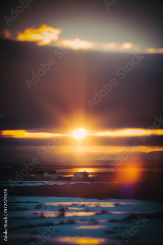 Sunset over a lake sea in Iceland black sand 