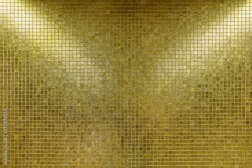 Decorative glittering glass tiles in radiant gold.