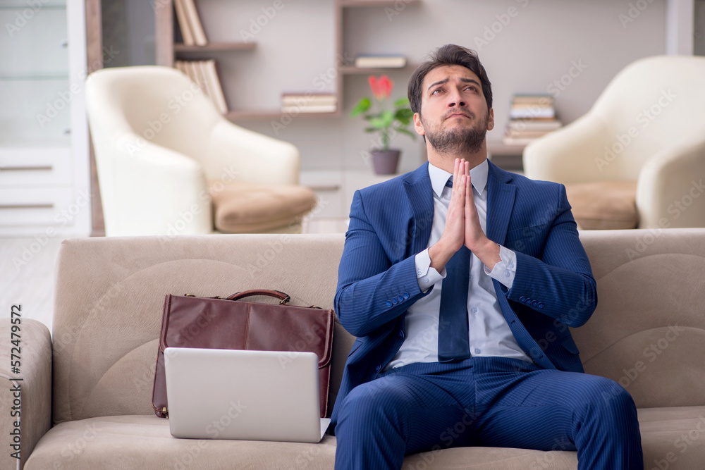 Young male employee working from home during pandemic Young male employee working from home during pandemic