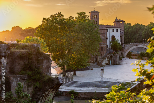  Isola Tiberina or Isola Tiberina in Rome.Italy. Isola dei Due Ponti, Licaonia, San Bartolomeo Island at sunset. An ancient river island of the Tiber with historical monuments, center of Rome. © SNAB