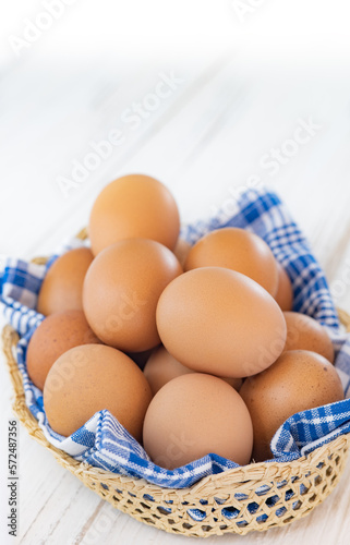 Egg in a basket on wooden table ,Chicken Egg
