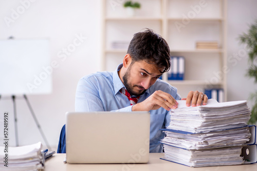 Young male employee working in the office