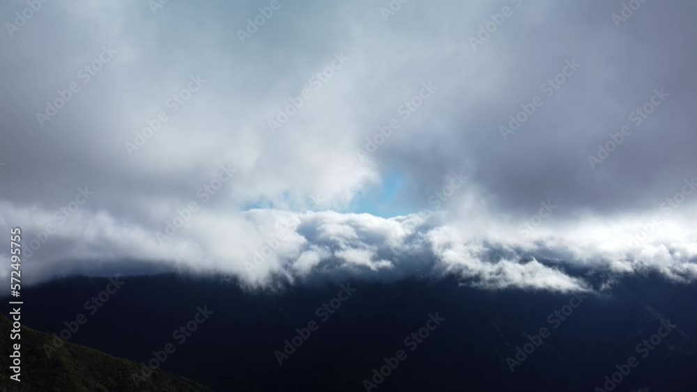 Dramatic mountains with low-level clouds Madeira Island, Aerial descending view Dramatic mountains with low-level clouds Madeira Island, Aerial descending view