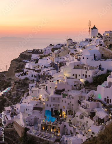 Sunset at the Greek village of Oia Santorini Greece with a view over the ocean caldera of Santorini photo