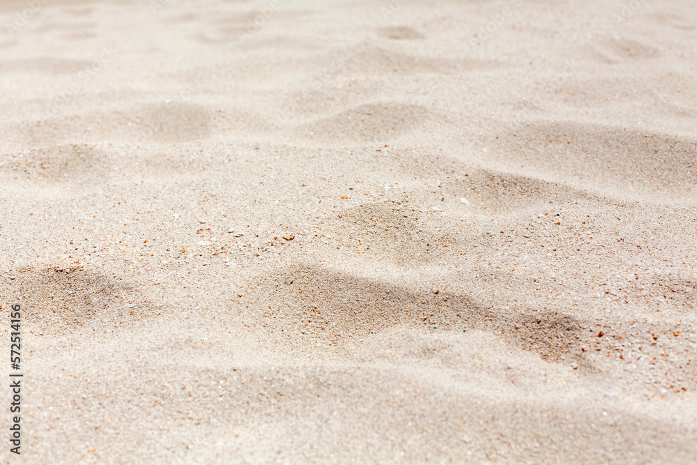 White sand texture close up background, wavy sandy pattern, natural dry sand grains backdrop, clean beige rippled sand surface top view, light yellow desert dune, summer tropical sea beach, copy space