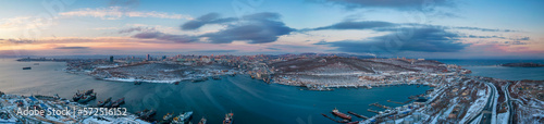 Winter sunset aerial panorama of Vladivostok city surrounded by Sea of Japan, Far East of Russia