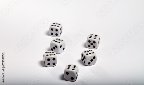 Game data. Focus on the first dice  blurring behind with white background. Table game. Board game. Casino game. Dots.