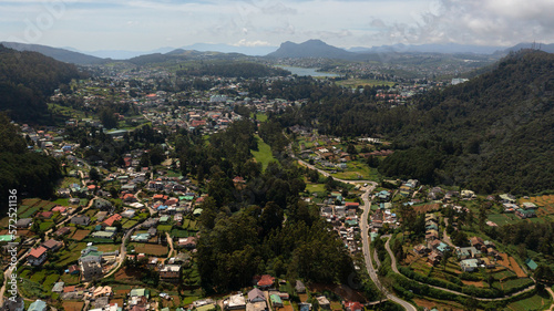 Aerial view of Mountain town of Nuwara Eliya among tea plantations in mountains. Sri Lanka.