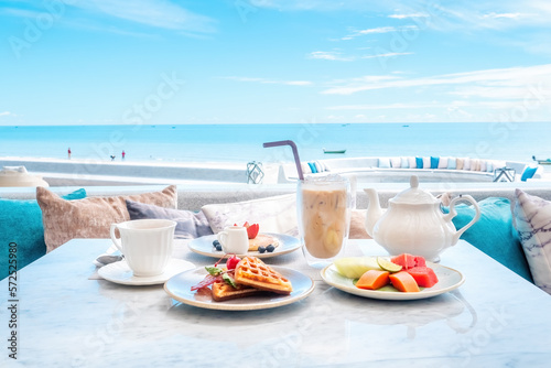 Photography Beautiful morning on beach of beachfront hotel breakfast