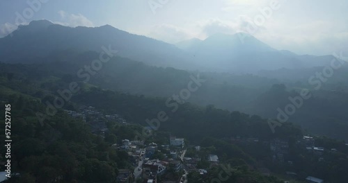 Mountain Village of Xilitla Mexico on cloudy Humid Tropical Thunderstorm Day Another Pan looking towards moutnains photo