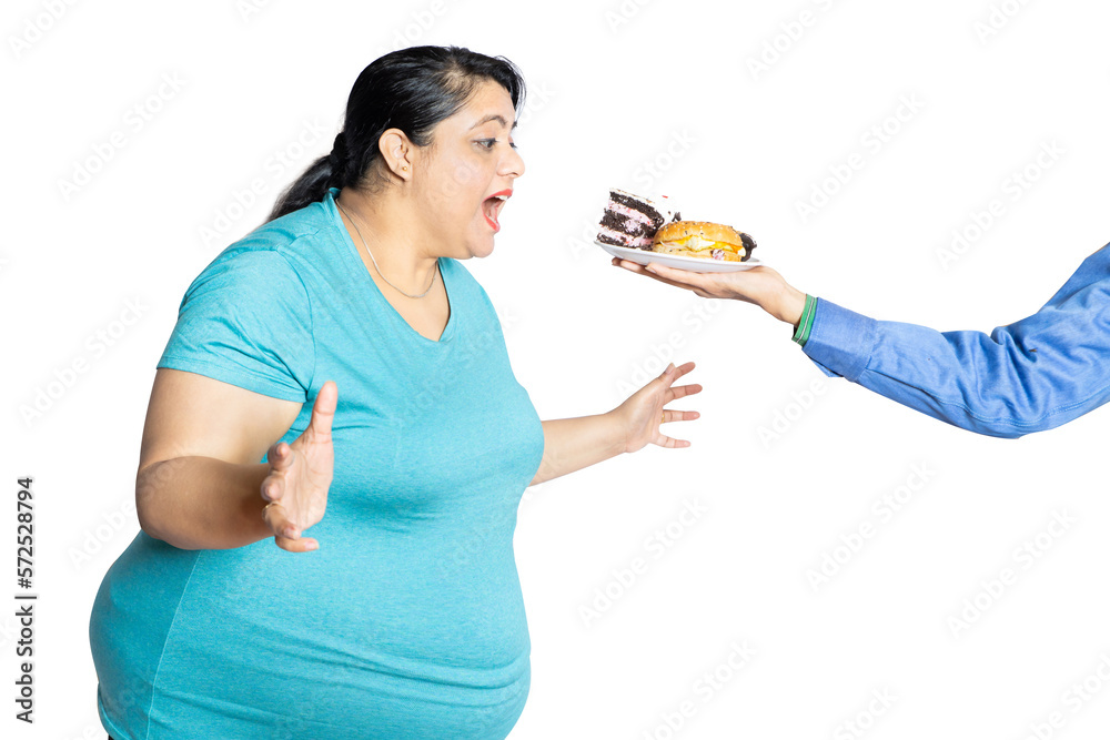 Hand serve burger and cake, Overweight woman tempting to eat junk food isolated over white background, Hungary fat lady with open mouth to eat fast food. Hand serve burger and cake, Overweight woman tempting to eat junk food isolated over white background, Hungary fat lady with open mouth to eat fast food.