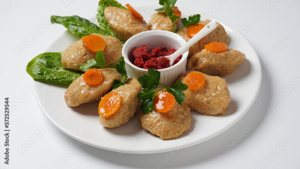 Gefilte fish with carrots, lettuce, horse radish. Passover traditional Jewish food - celebration concept