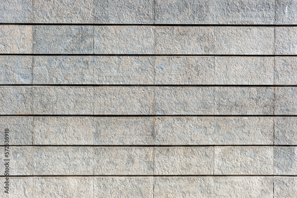 Background from a wall made of gray granite stones Background from a wall made of gray granite stones