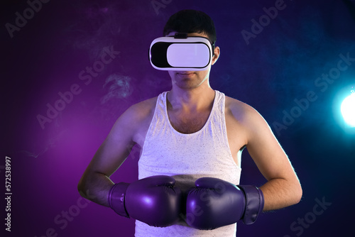 Young man with VR glasses a...