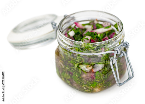 Some Homemade Chimichurri isolated on white (selective focus)