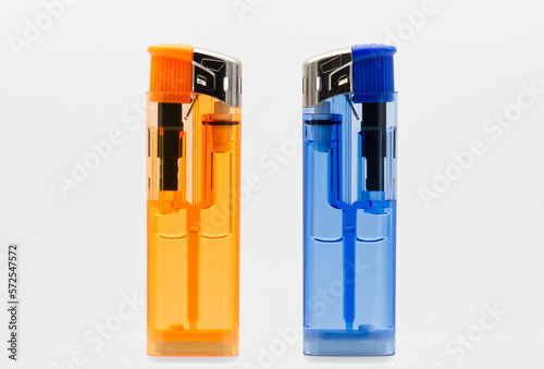 Blue and orange lighters isolated on white background.