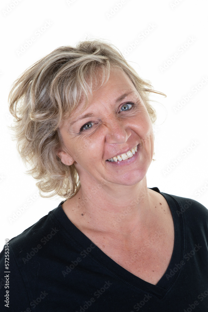 Charming senior portrait beautiful blond mature woman smiling at camera on white background Charming senior portrait beautiful blond mature woman smiling at camera on white background