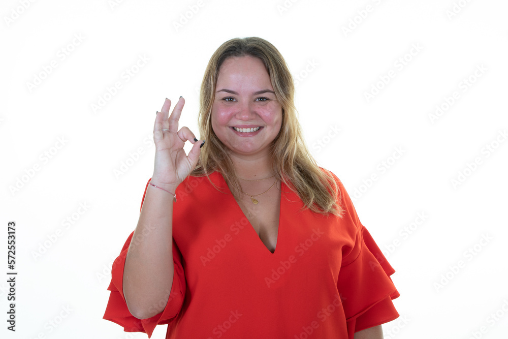 Obraz premium plus size blonde pretty woman smiling happy ok hand sign finger in victory sign