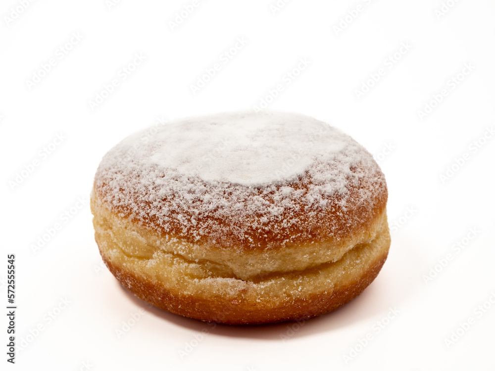 Freshly baked and dusted with powdered sugar German donuts. Donut berliner or krapfen on white background.