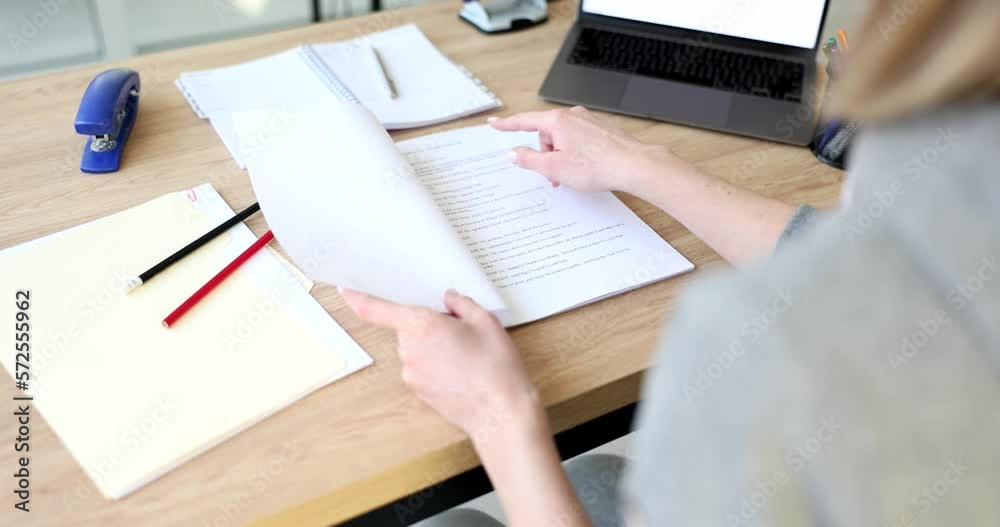 Woman opens script and reads plot of new film