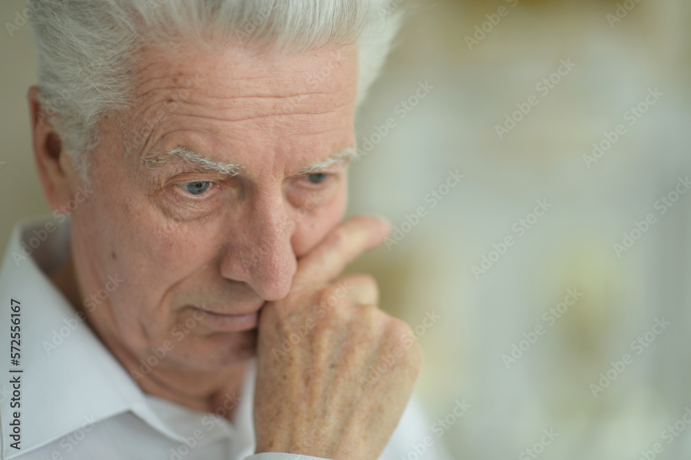 portrait of thoughtful senior man portrait of thoughtful senior man