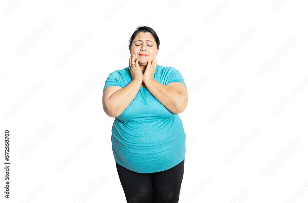 Overweight indian woman dreaming of something isolated over white background, Copy space. Fat asian young girl wearing casual T-shirt . Obesity concept. Overweight indian woman dreaming of something isolated over white background, Copy space. Fat asian young girl wearing casual T-shirt . Obesity concept.